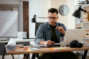 Young,Stressed,Handsome,Businessman,Working,In,Office.,Angry,Businessman,With